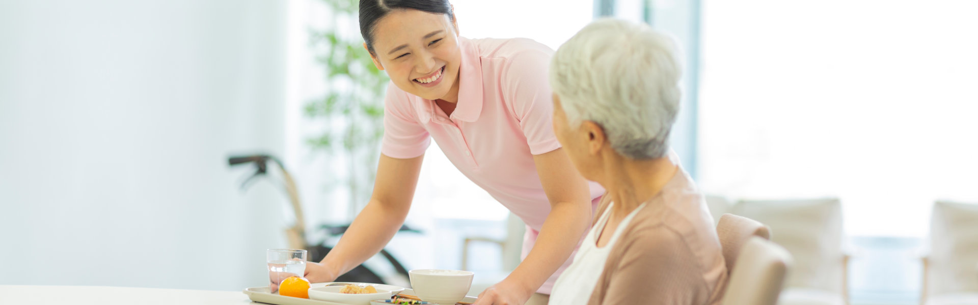 Female served a food to the elder woman