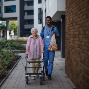 Male nurse guide the elder woman